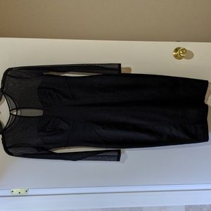 Body-skimming black dress with sheer paneling